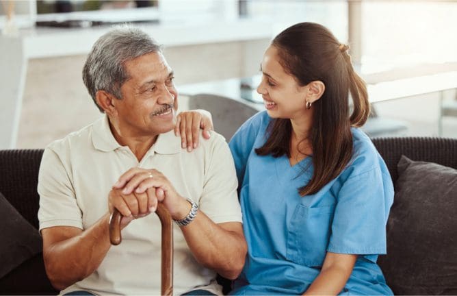 A woman and an older man holding hands.