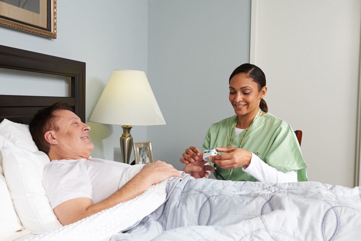 women giving hospice care service at home