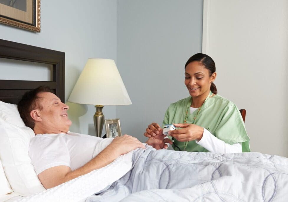 women giving hospice care service at home